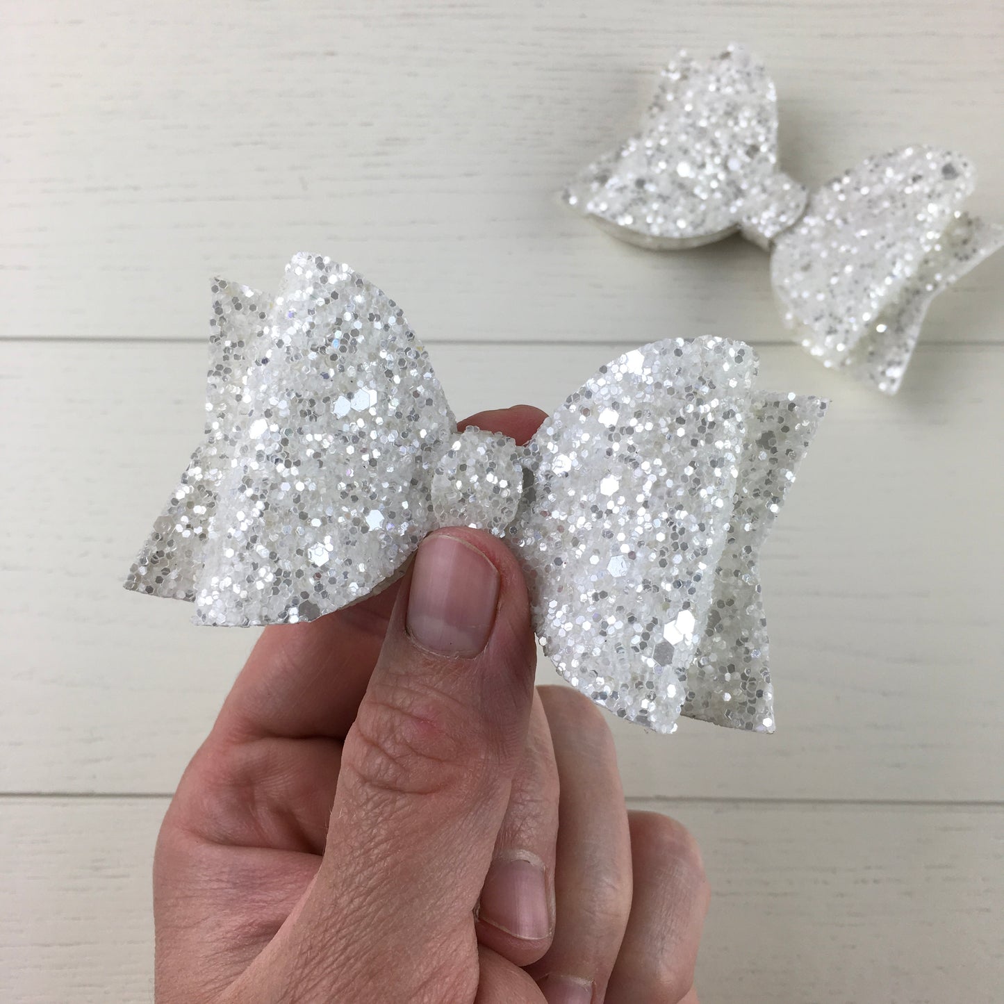 another angle showing the white bow shimmer with silver sparkle