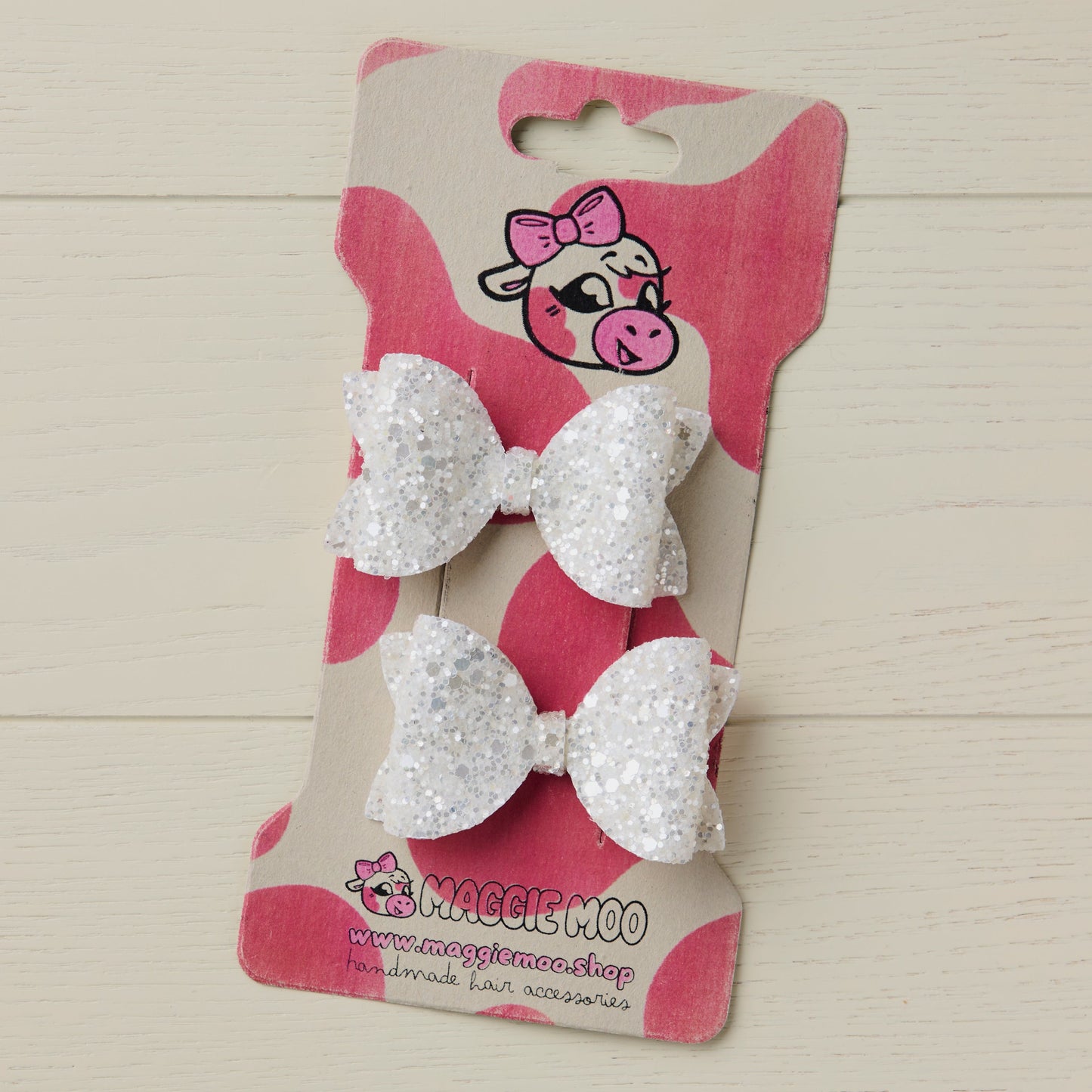Pearl White Jazz Glitter Hair Bows on a display card