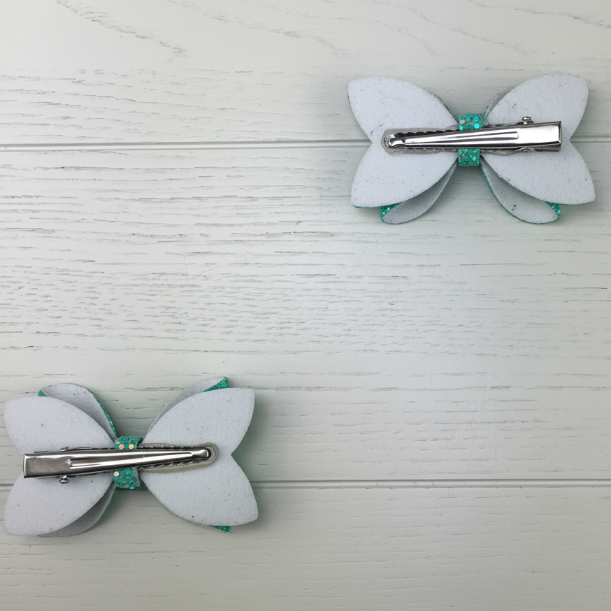 Back view of teal mini bows square