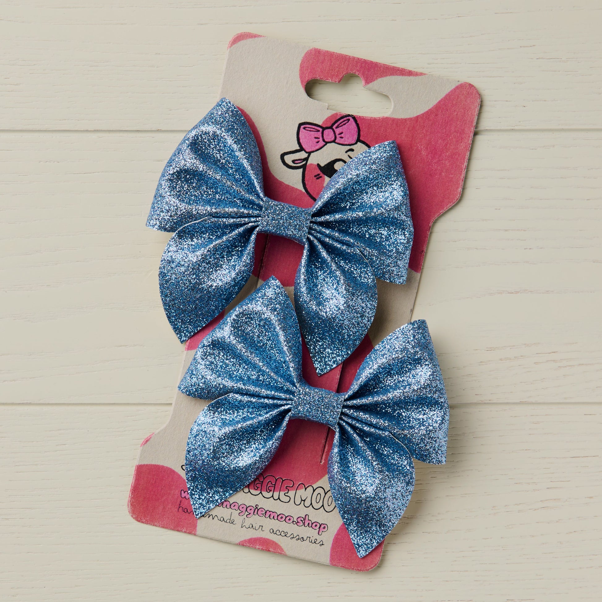 Metallic Blue glitter bows on a display card