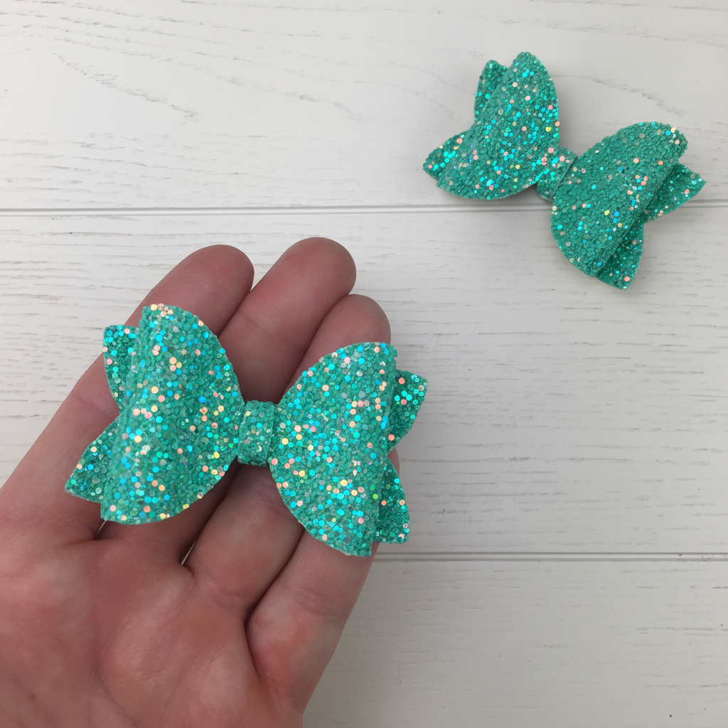 Turquoise glitter bow square